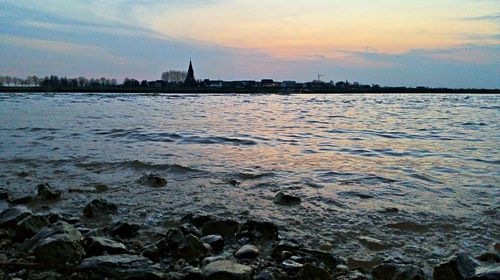 Scenic view of sea at sunset