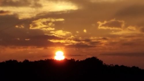 Scenic view of silhouette landscape against sky during sunset