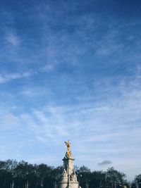 Low angle view of victoria memorial statue against sky