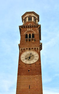 Low angle view of clock tower against sky