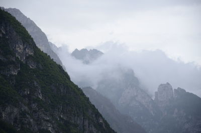 Scenic view of mountains against sky during foggy weather