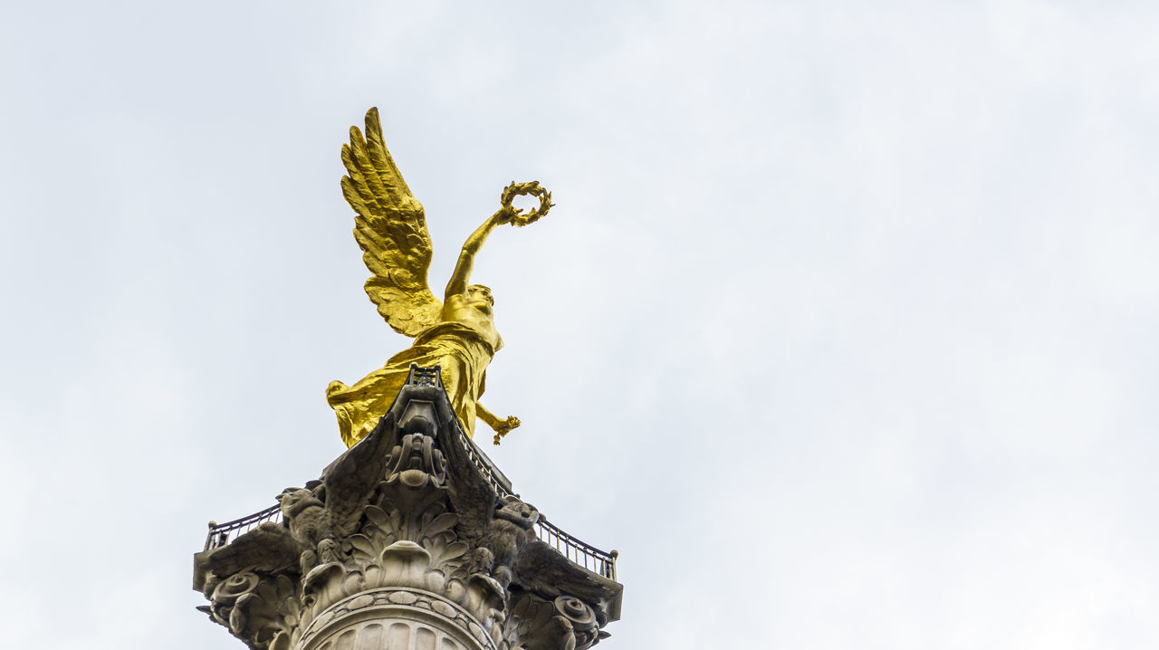 statue, low angle view, sculpture, human representation, art and craft, art, creativity, sky, architecture, built structure, religion, history, clear sky, building exterior, famous place, spirituality, place of worship, copy space, travel destinations