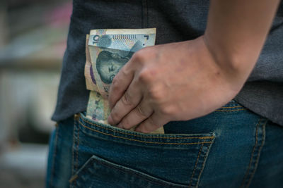 Close-up of man holding hands