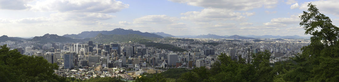 Panoramic view of city against sky