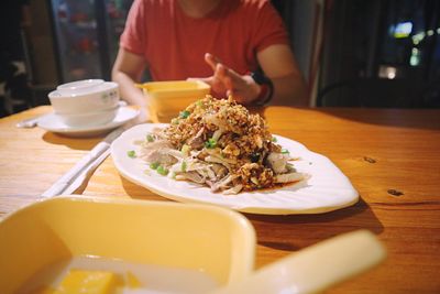 Close-up of man eating food