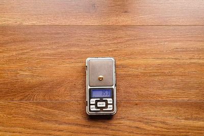 Directly above shot of telephone booth on table