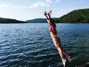 Woman diving into lake