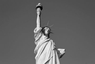 Low angle view of statue against sky