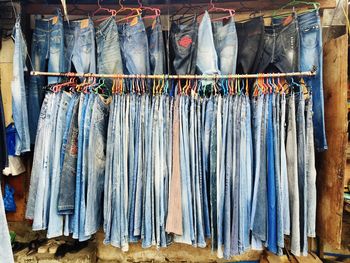 Jeans hanging at market for sale