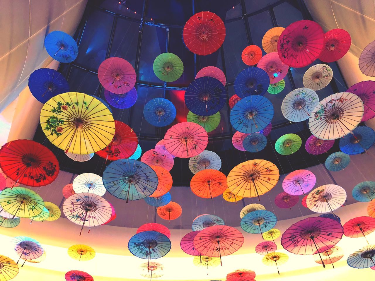 multi colored, low angle view, choice, variation, no people, large group of objects, umbrella, decoration, creativity, art and craft, hanging, protection, for sale, retail, design, pattern, market, day, abundance, outdoors, floral pattern