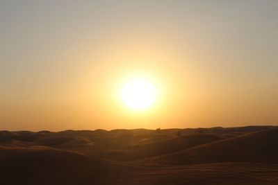 Scenic view of landscape at sunset