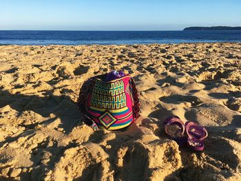 Artistic bag laying on the beach 