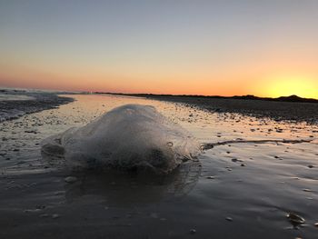 Scenic view of sea against clear sky during sunset