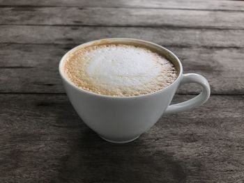Close-up of cappuccino on table