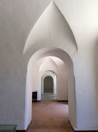 Arch bridge in front of building