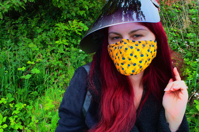 Portrait of woman with plants