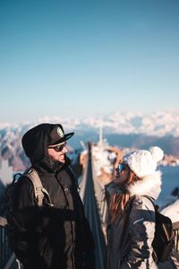 People standing in winter against sky