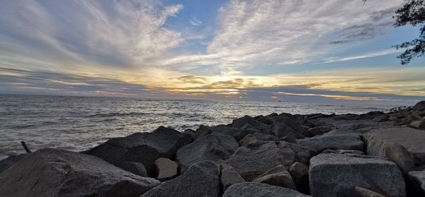 Scenic view of sea against sky during sunset