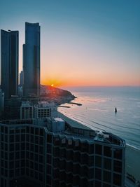 Cityscape against sky during sunset