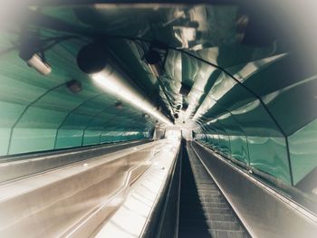 Low angle view of illuminated escalator