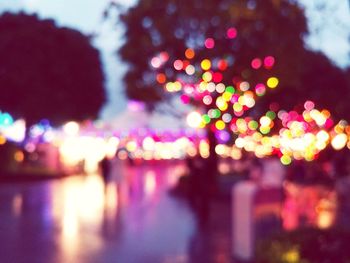 Defocused image of illuminated christmas tree at night