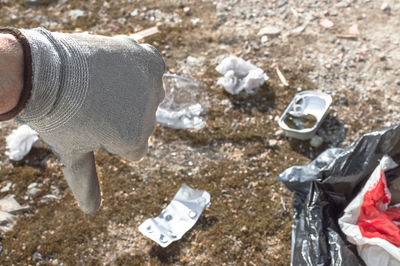 High angle view of garbage on rock