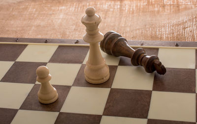 High angle view of chess pieces on floor