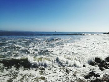 Scenic view of sea against clear sky