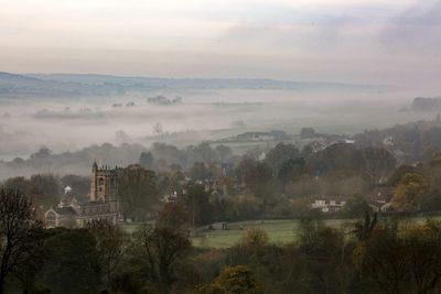 High angle view of town with fog during at morning