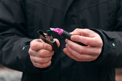 Close-up of man holding hands