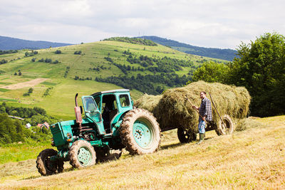 Tractor on field against sky