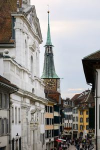 Buildings in city against sky