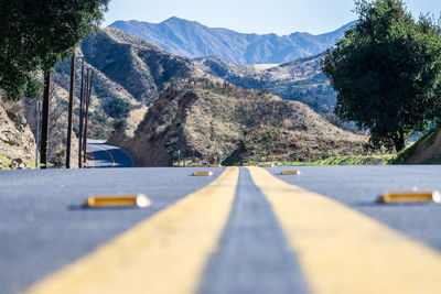 Surface level of road against mountain range