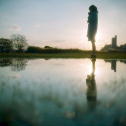 Reflection of woman in water