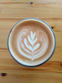 Close-up of cappuccino on table