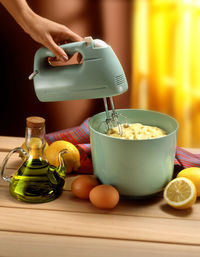 Midsection of person preparing food on table