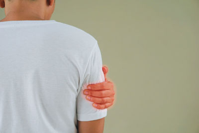 Rear view of man holding ice cream