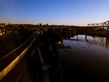 High angle view of bridge over river against sky in city