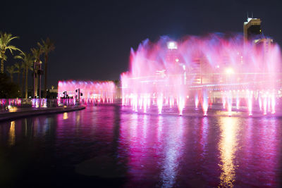 View of illuminated ferris wheel at night