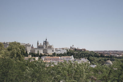 Town against clear sky