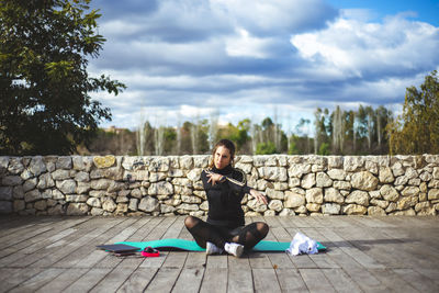 Full length of woman exercising outdoors