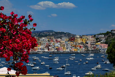 High angle view of townscape on the sea against sky