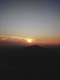 Scenic view of silhouette landscape against sky during sunset