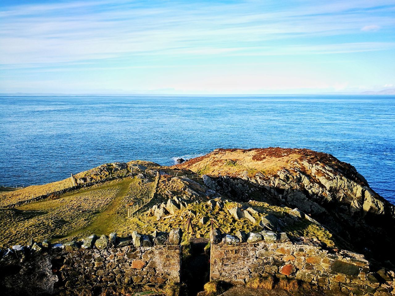 ROCK FORMATIONS BY SEA AGAINST SKY