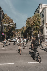 People riding bmx bicycles on street