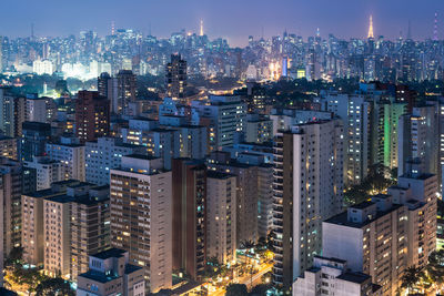 High angle view of illuminated buildings at night