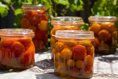 Close-up of fruits in glass jar on table