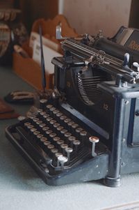 Close-up of vintage typewriter on table