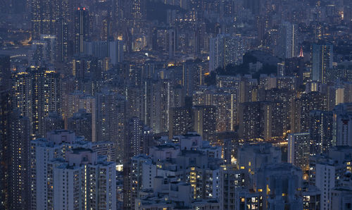 High angle view of illuminated city buildings at night