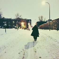 People standing on snow covered landscape